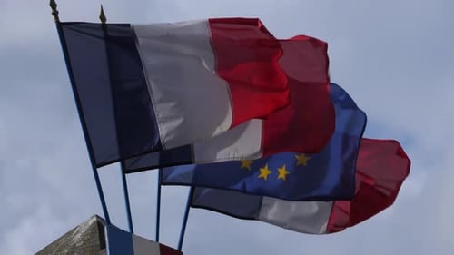 French and EU Flags Waving in the Wind