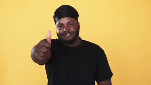 Enthusiastic Man Gives a Thumbs Up Gesture