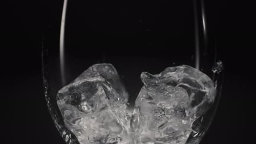 Ice Cubes Rotating in a Glass Cup