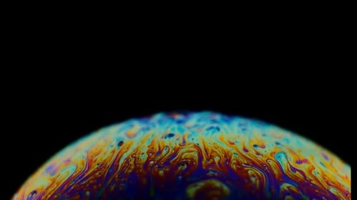 Multicolored Rainbow Colors of a Single Soap Bubble That Looks Like a Fantasy Planet Isolated