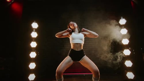 Pretty Brunette Dancing Twerk In Studio With Flashing Light