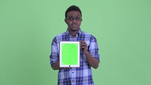Young Adult Holding Tablet with Green Screen Talking