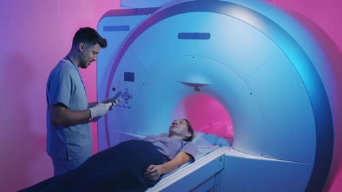 Doctor Talking to Patient during MRI Procedure