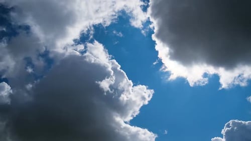 Clouds Float Peacefully Across a Bright Blue Sky