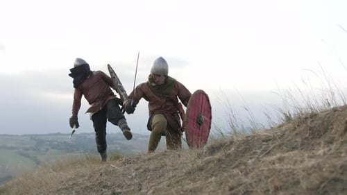 Medieval Warriors Battle With Swords and Axes