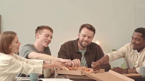 Colleagues Eating Pizza in Office