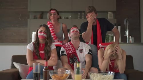 Friends Watch Tense Sports Game Together at Home
