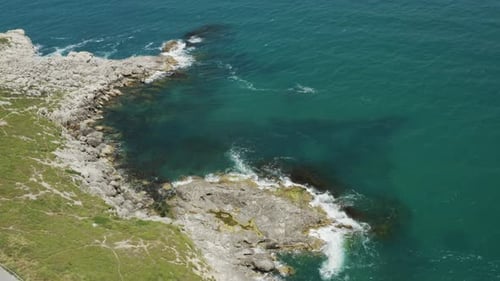 Clean Sea Waves And Rocks Aerial View