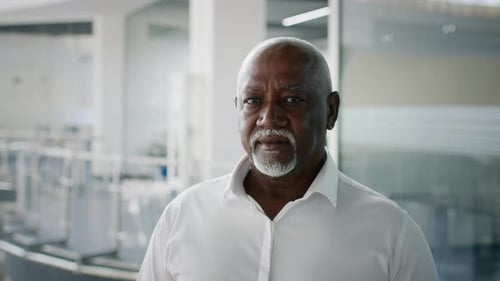 Closeup Portrait Of Confident Mature Black Businessman Standing In Modern Business Center