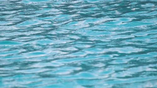 Closeup Seascape Surface of Blue Sea Water with Small Ripple Waves