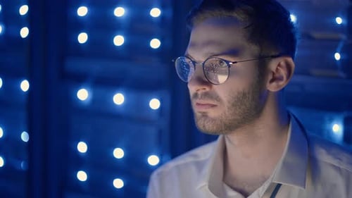 Data Center IT Specialists Coworking in Secure Server Room of Cyberspace