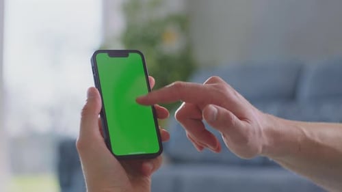 Hand Using Mobile Phone with Green Screen