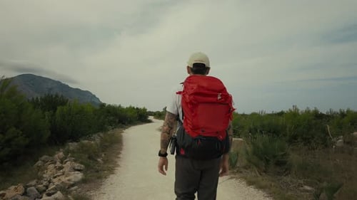 Man with Backpack Walk on Hiking Trail in Summer