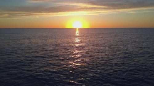 Aerial View Drone Flying Over Sea Surface in Evening Sun Light, Golden Hour Sunset, Cinematic Shot