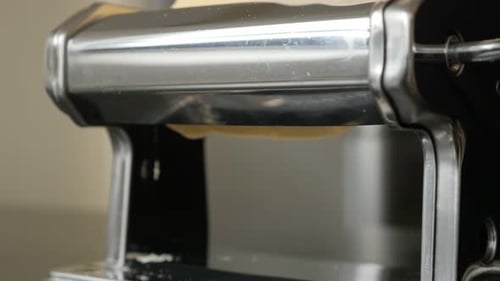 Dough shaped in pasta machine 4K 2160p 30fps UltraHD footage - Close-up of manual processed lasagna