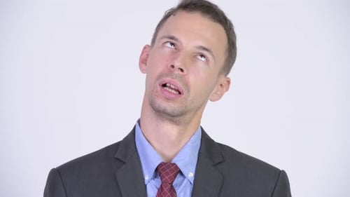 Studio Shot of Businessman Looking Bored