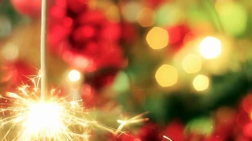 Sparkling Sparkler Over Festive Christmas Bokeh Background