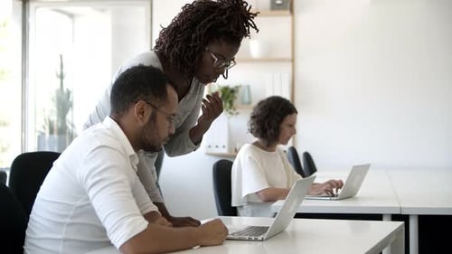 Focused Employees Working with Modern Devices