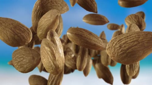 Falling Almonds on Blue Background
