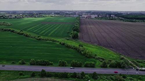Aerial View of Road Passing Through a Rural Landscape