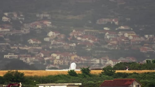 Airplane Taking off Near Homes