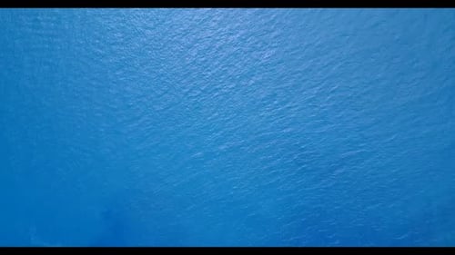 Aerial above landscape of paradise tourist beach journey by blue lagoon with white sandy background