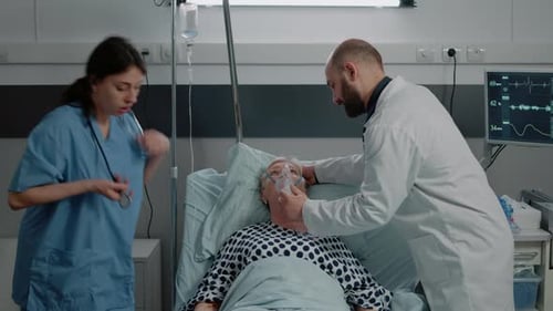 Senior Patient Receives Medical Care in Hospital Bed