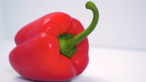 Vibrant Red Bell Pepper Close Up on White Background