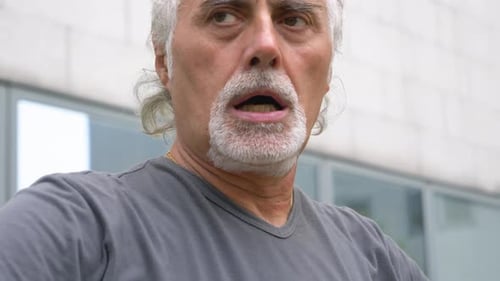 Man with Gray Hair Talking Close-Up