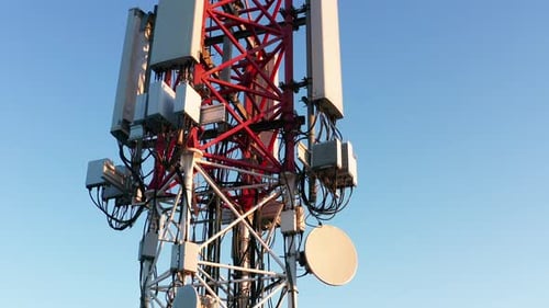 Telecommunications tower carrying broadcasting antennas for 3G, 4G and 5G cellular networks.