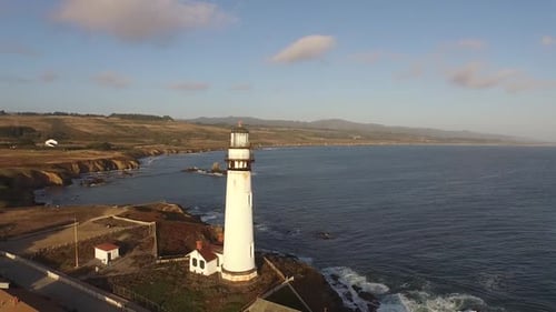 Aerial View of Coastal Lighthouse on Sunny Day