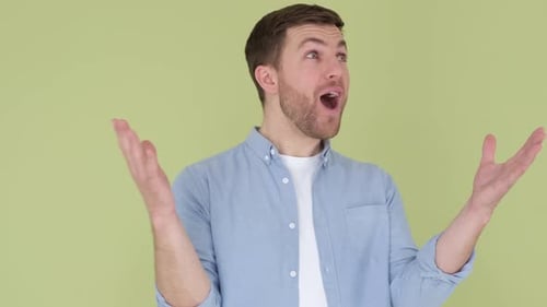 The Young European is Shocked and Shocked By the Words WOW Joy on a Man's Face Close Up