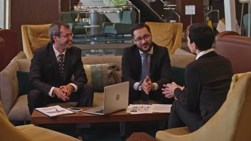 Business Discussion in the Hotel Lobby