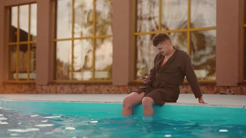 Adult Man is Resting in Spa Thermal Bath in Recreation Center Relaxing Near Warm Pool Outdoor