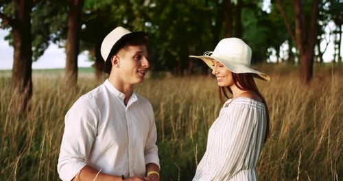 Romantic Couple in Field of Tall Grass, Smiling