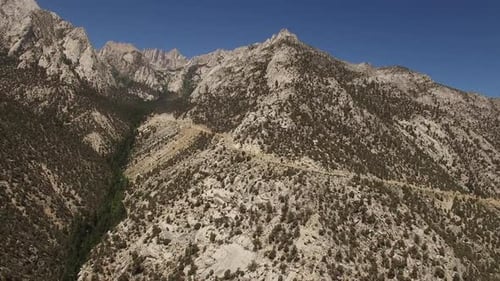 Majestic Mountains and Winding Road Aerial View