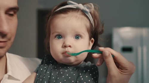 Close Up of Baby Being Fed with Spoon