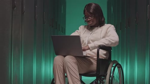 Woman in Wheelchair in Data Center
