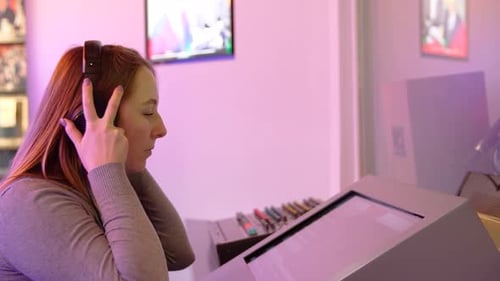 Woman records sound on old mixer