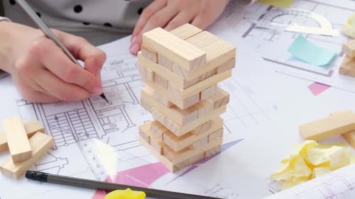 Architect Designer Interior Creative Working Hand Drawing Blueprints in Office Workplace Block Wood