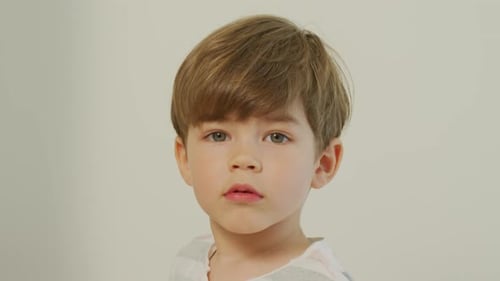 Child Stares at Camera in a Close Up Shot