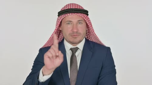 Man in Suit Gestures 'No' on White Background