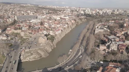 Aerial view of Metekhi church in old Tbilisi located on cliff near river Kura. Georgia 2021 Spring