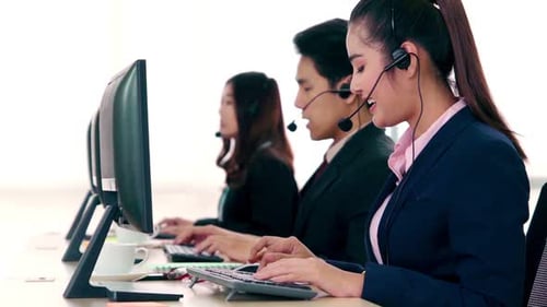 Business People Wearing Headset Working in Office