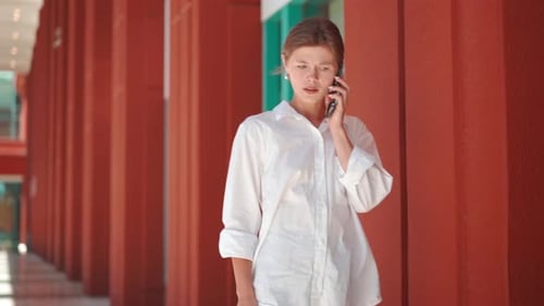 Frustrated Business Woman Talking Mobile Phone