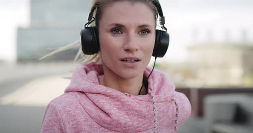 Front view of running woman in the city