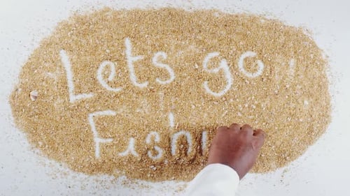 Hand Writing On Sand Lets Go Fishing