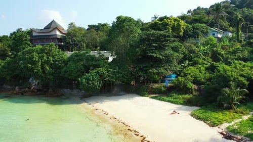 Wide angle overhead abstract view of a white sandy paradise beach and blue water background