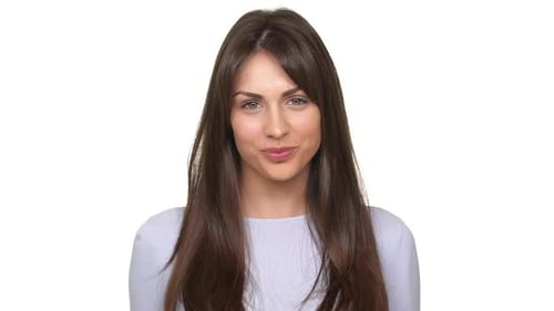 Woman Smiling and Posing Against White Background
