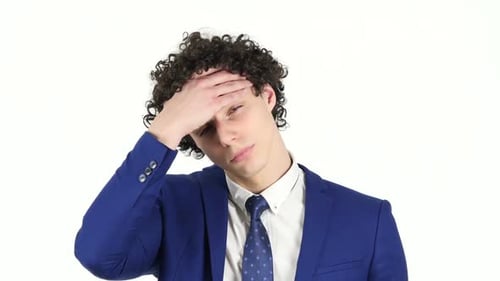 Man in Suit Experiencing Headache